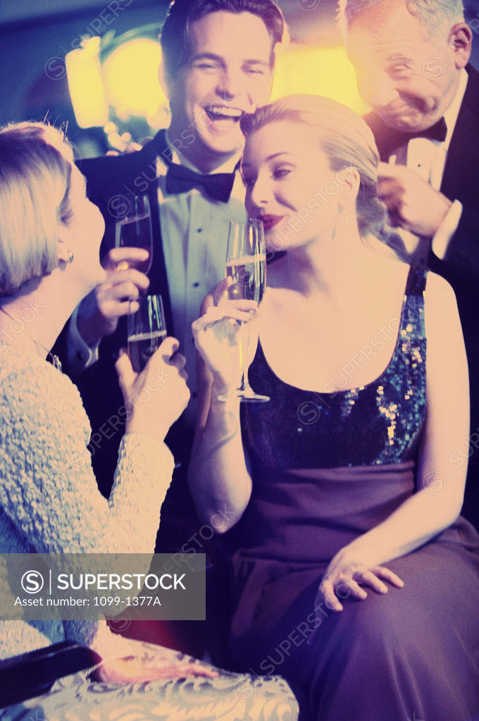 Stock Photo: 1099-1377A Young couple and a mature couple at a nightclub