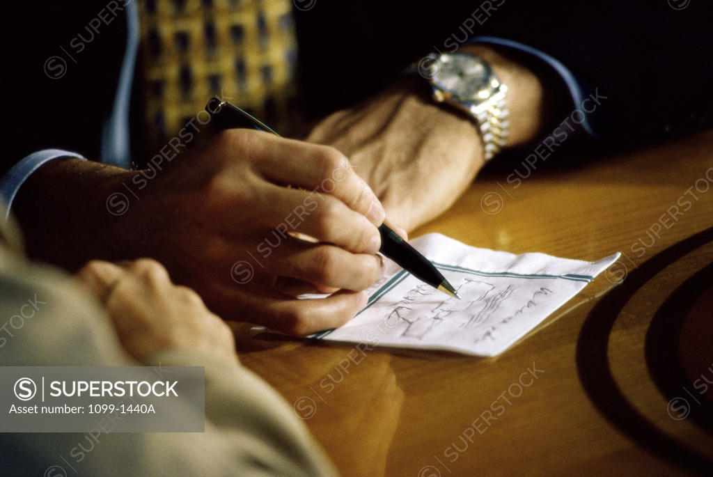Stock Photo: 1099-1440A Close-up of a businessman writing on paper