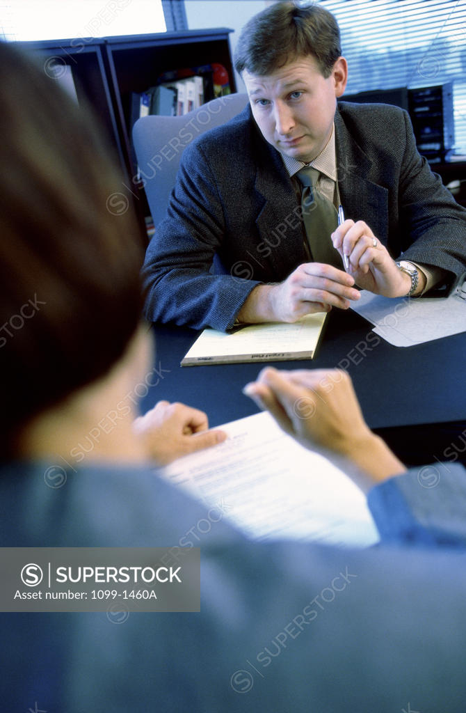 Stock Photo: 1099-1460A Businessman and a businesswoman in a meeting