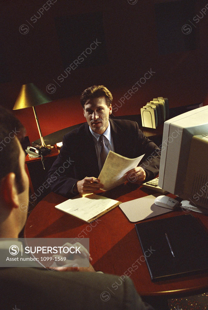 Stock Photo: 1099-1569 Two businessmen in a meeting