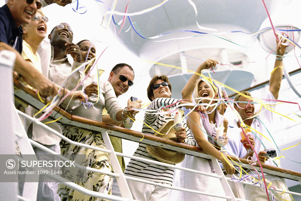 Stock Photo: 1099-1644 Low angle view of a group of people standing on a cruise ship