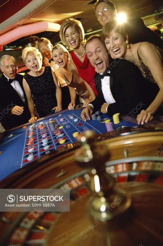 Group of people at the roulette wheel
