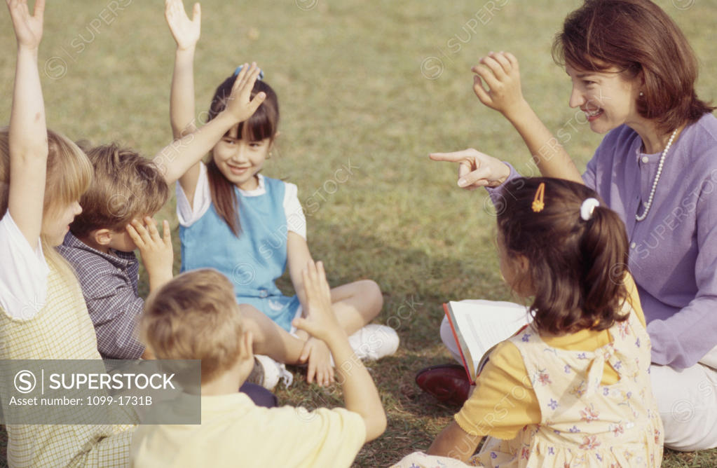 Stock Photo: 1099-1731B Female teacher playing with her students