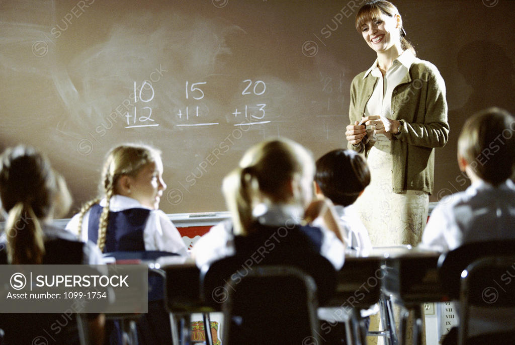 Stock Photo: 1099-1754 Teacher teaching mathematics in a classroom