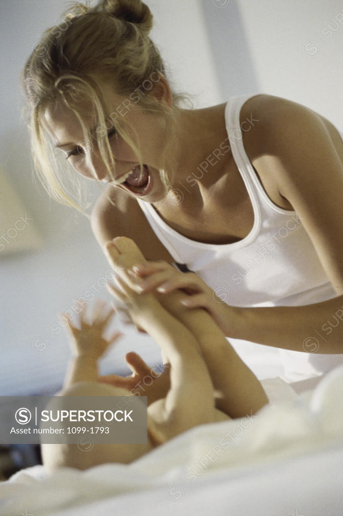 Stock Photo: 1099-1793 Mother playing with her baby boy