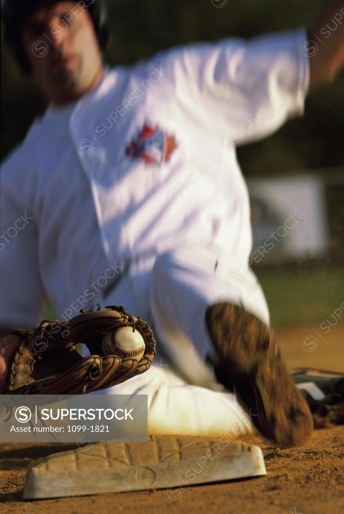 Stock Photo: 1099-1821 Baseball player sliding into a base