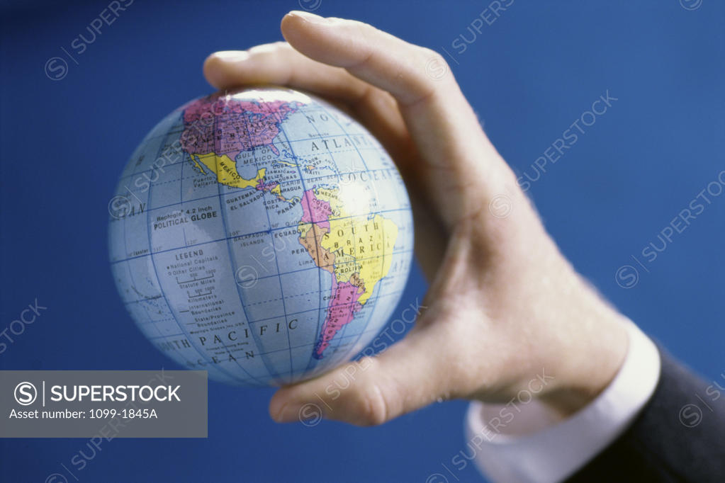 Stock Photo: 1099-1845A Close-up of a person's hands holding a globe