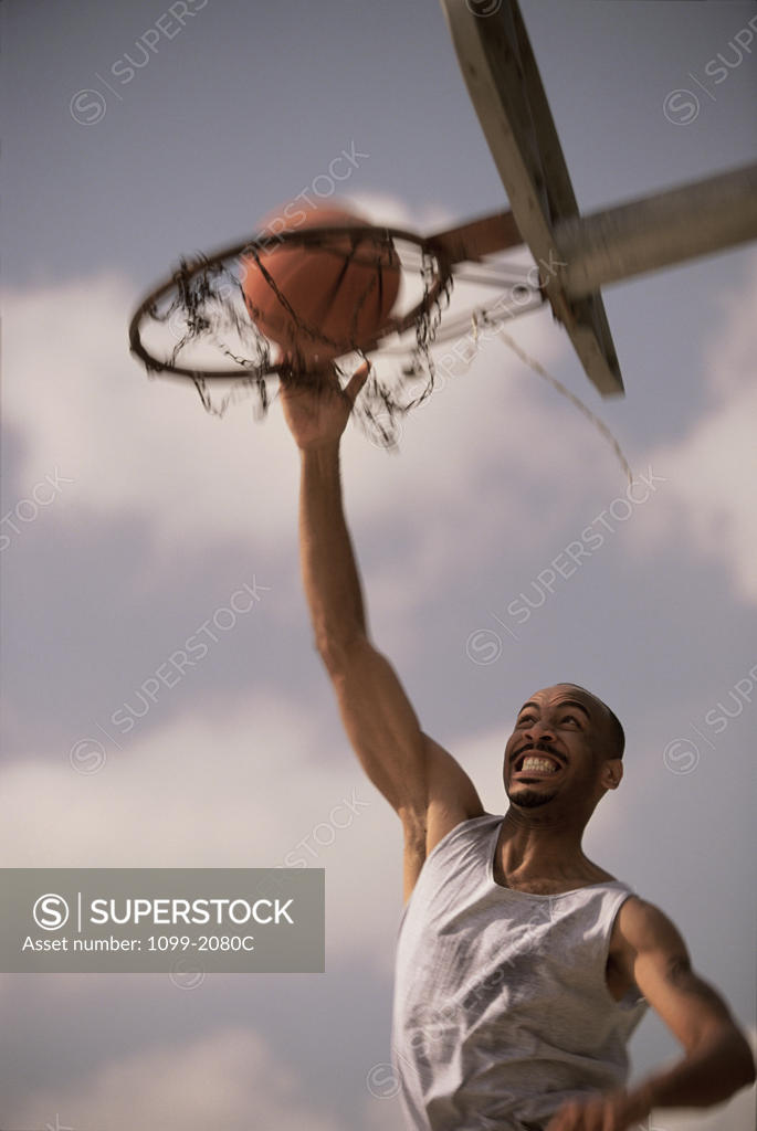 Stock Photo: 1099-2080C Young man playing basketball