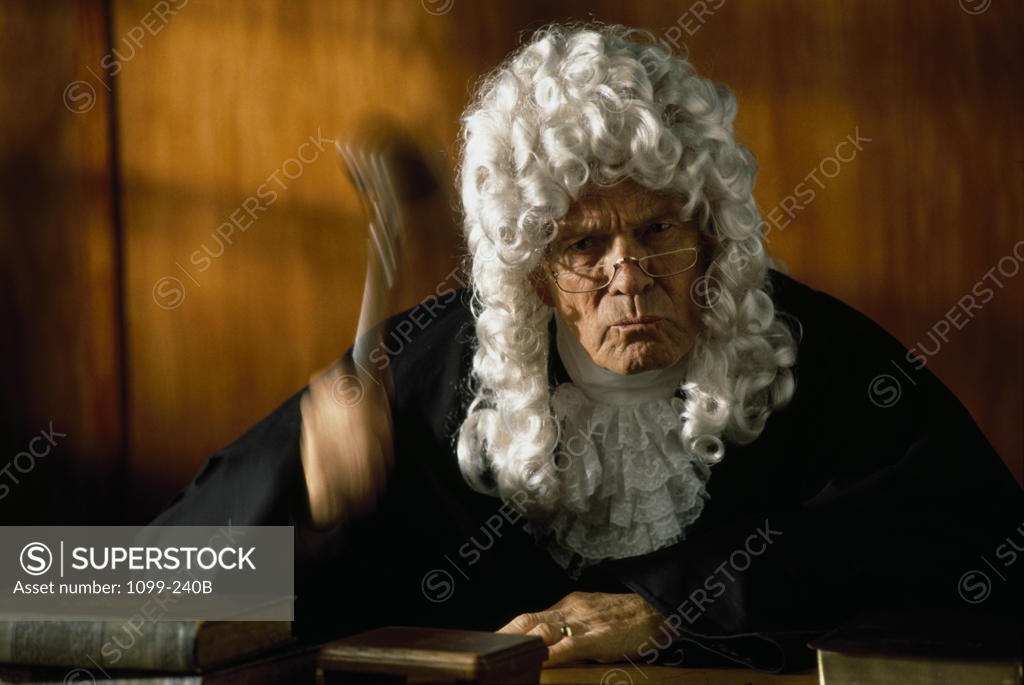 Stock Photo: 1099-240B Close-up of a judge holding a gavel