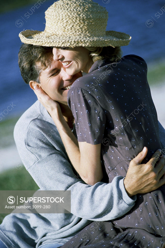 Stock Photo: 1099-280 Mid adult couple embracing each other