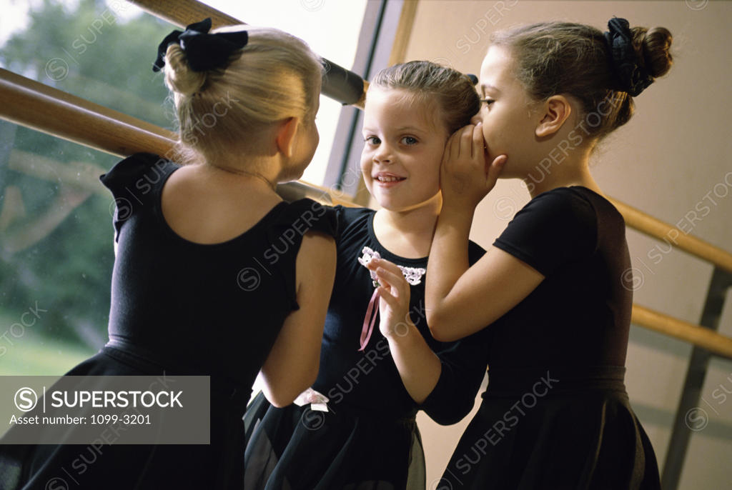 Stock Photo: 1099-3201 Three ballerinas whispering