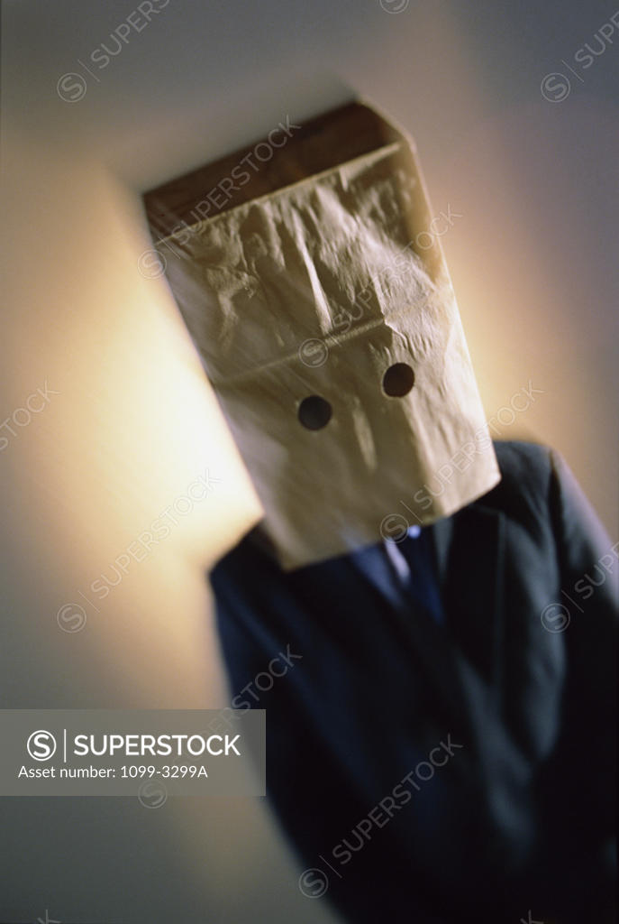 Stock Photo: 1099-3299A Businessman wearing a paper bag over his head