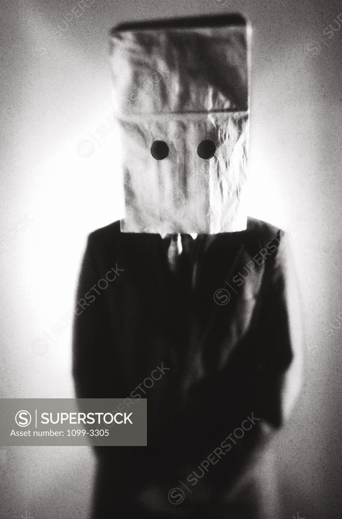 Stock Photo: 1099-3305 Businessman wearing a paper bag over his head