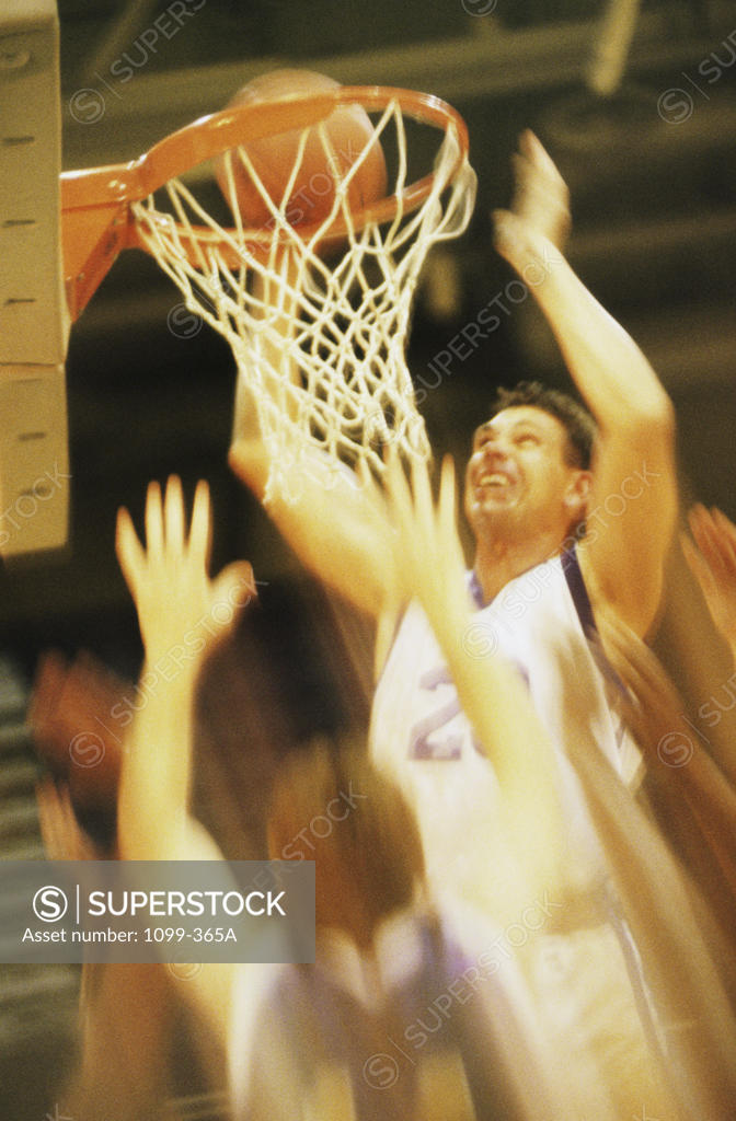 Stock Photo: 1099-365A Group of young men playing basketball