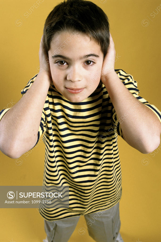 Stock Photo: 1099-3756 Portrait of a boy covering his ears with his hands