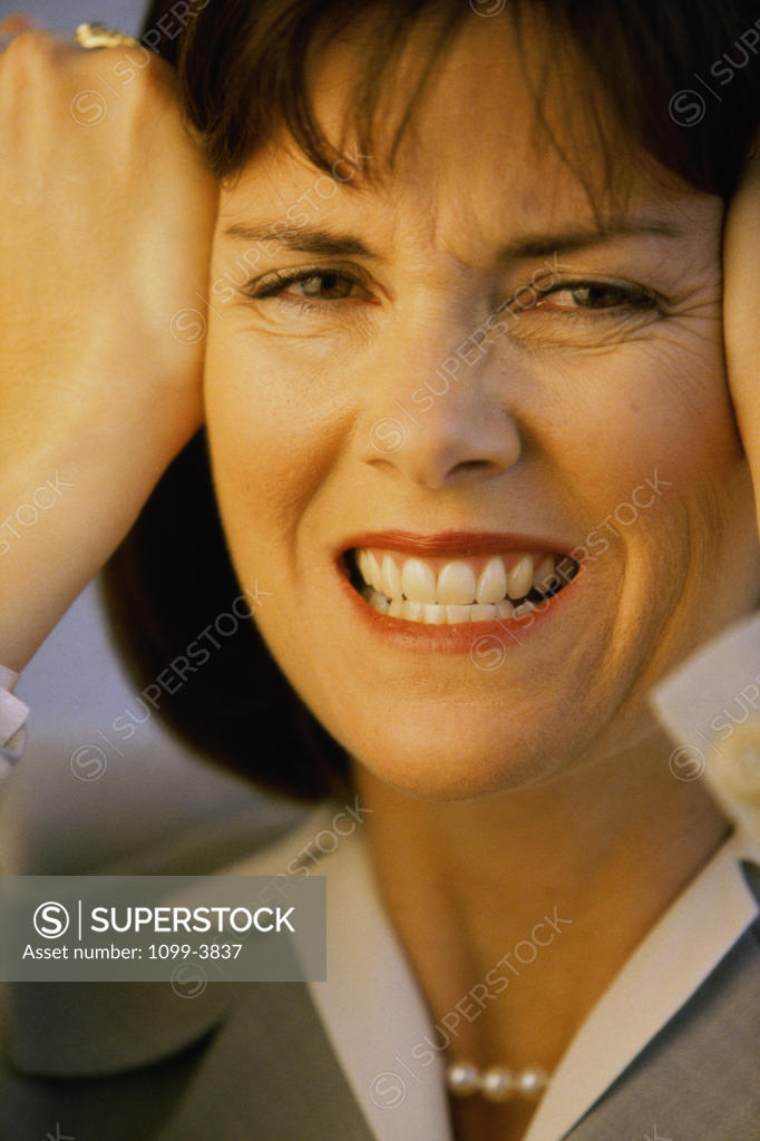 Stock Photo: 1099-3837 Portrait of a businesswoman clenching her teeth