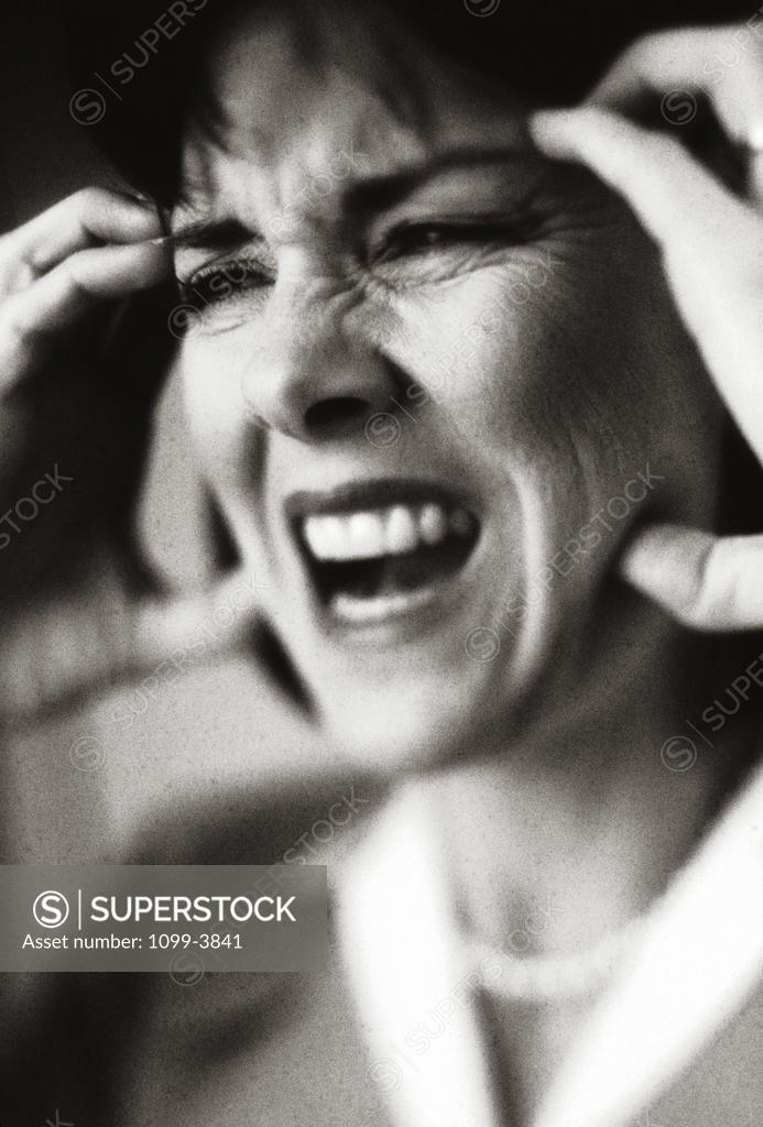 Stock Photo: 1099-3841 Mid adult woman suffering from a headache