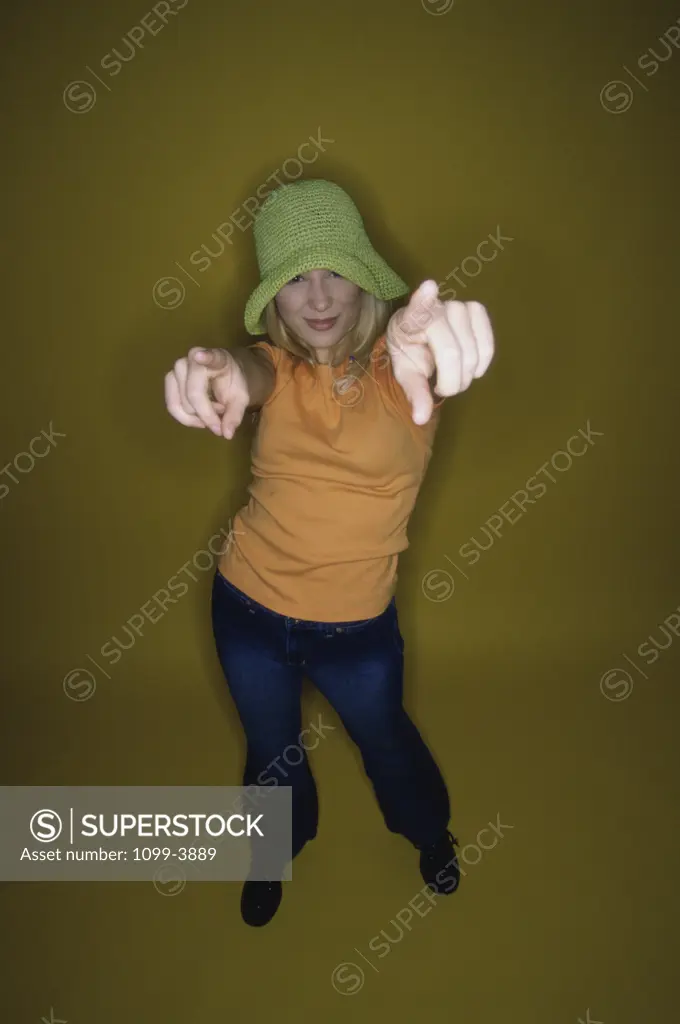 Portrait of a teenage girl pointing forward