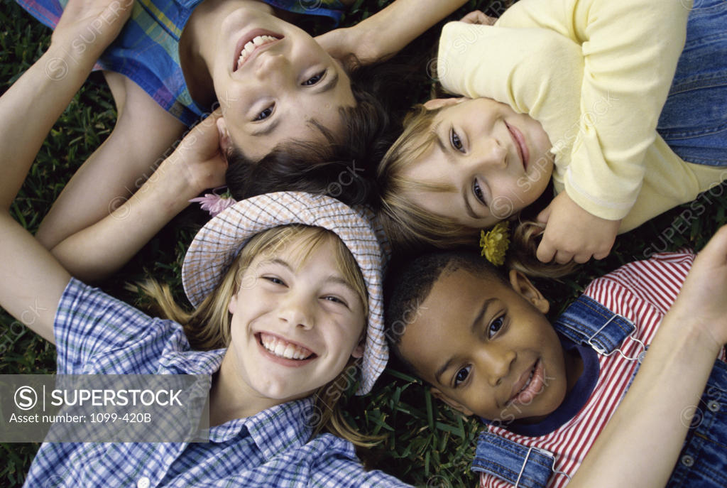 Stock Photo: 1099-420B Portrait of a group of children lying down