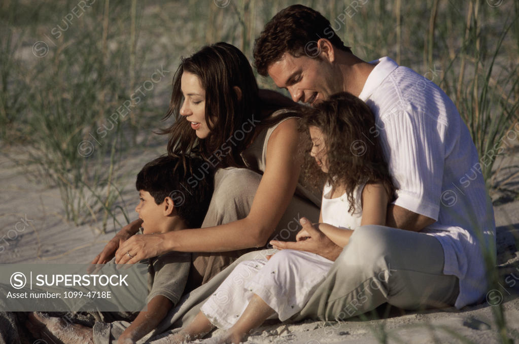 Stock Photo: 1099-4718E Couple sitting with their children