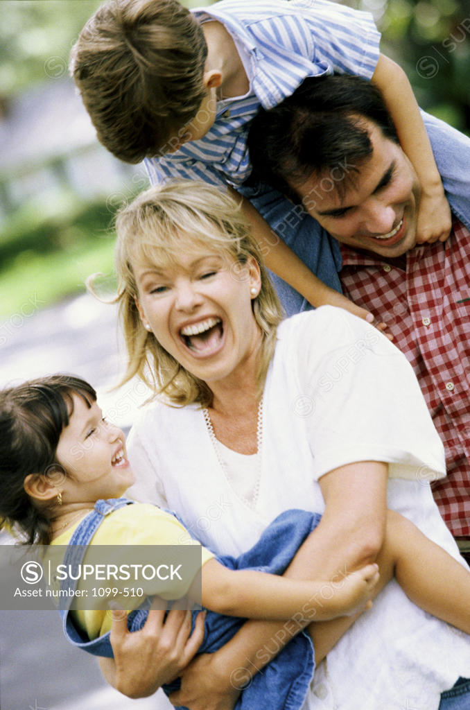 Stock Photo: 1099-510 Parents playing with their two sons