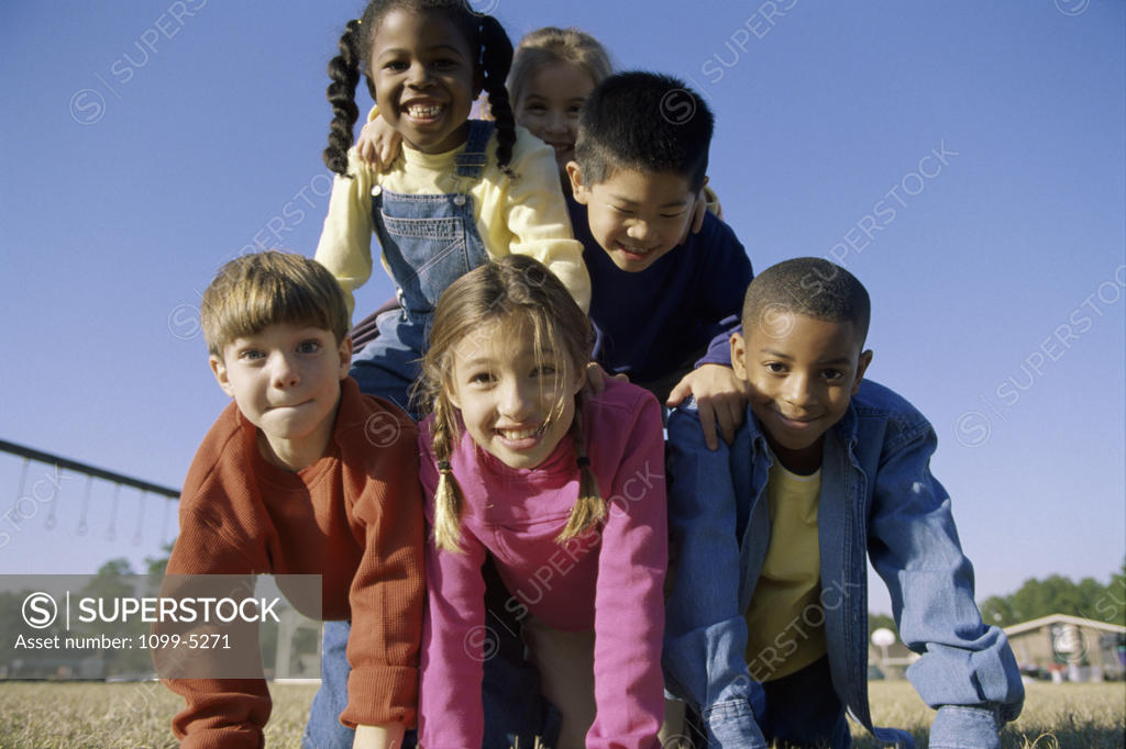 Stock Photo: 1099-5271 Portrait of a group of children making a human pyramid