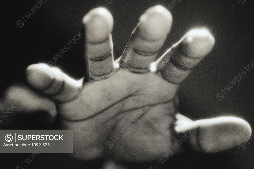 Stock Photo: 1099-5351 Close-up of a person's hand reaching forward