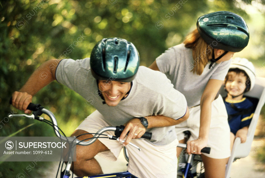 Stock Photo: 1099-612 Parents cycling with their son