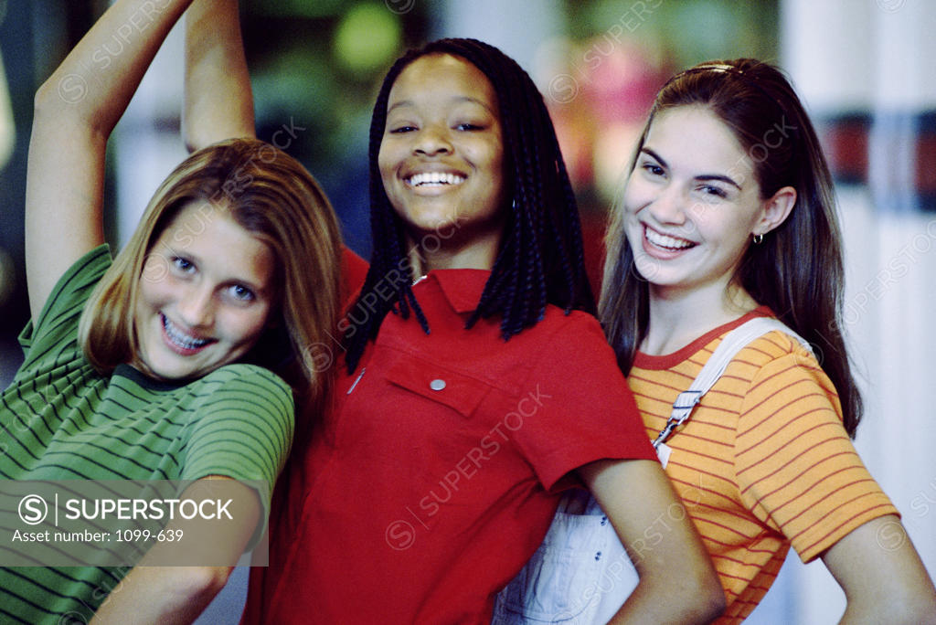 Stock Photo: 1099-639 Portrait of three teenage girls smiling