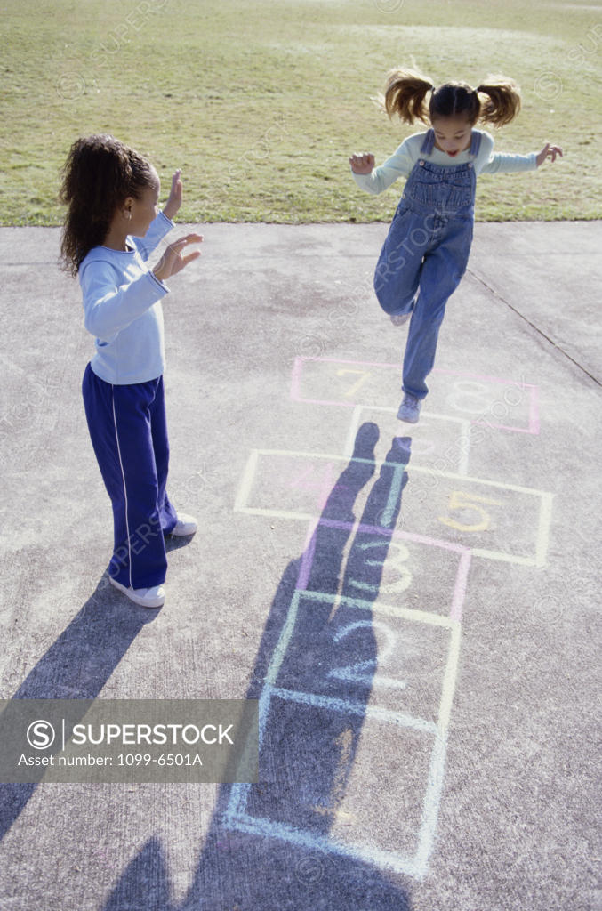 Stock Photo: 1099-6501A High angle view of two girls playing hopscotch