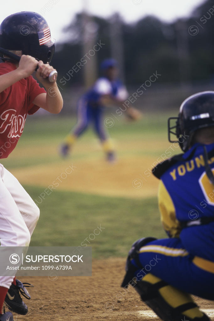 Stock Photo: 1099-6739A Three boys playing baseball