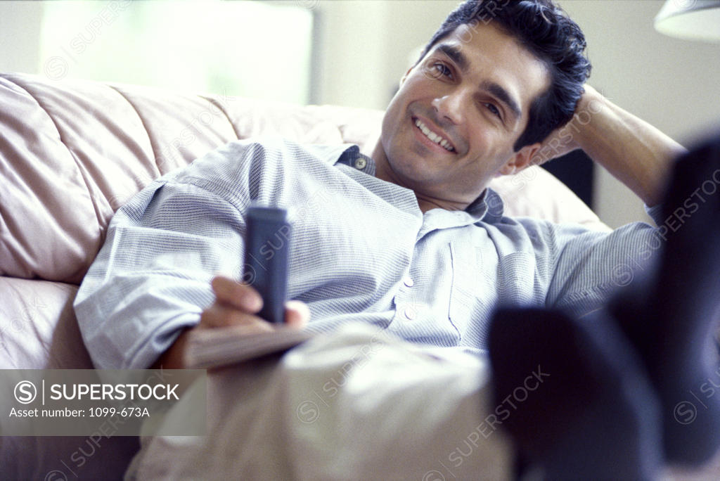 Stock Photo: 1099-673A Young man watching television