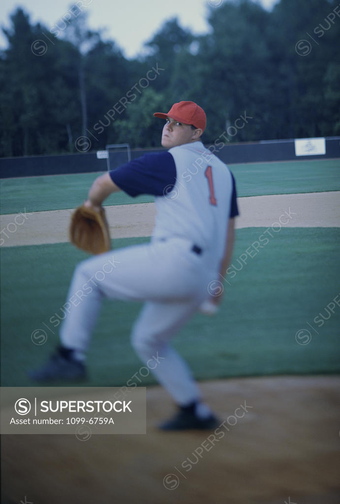 Stock Photo: 1099-6759A Baseball player throwing a baseball