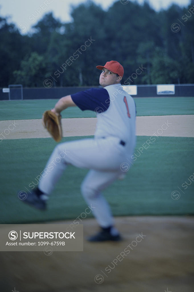 Stock Photo: 1099-6759B Baseball player throwing a baseball
