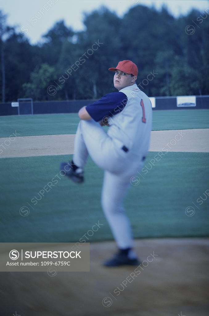 Stock Photo: 1099-6759C Baseball player throwing a baseball