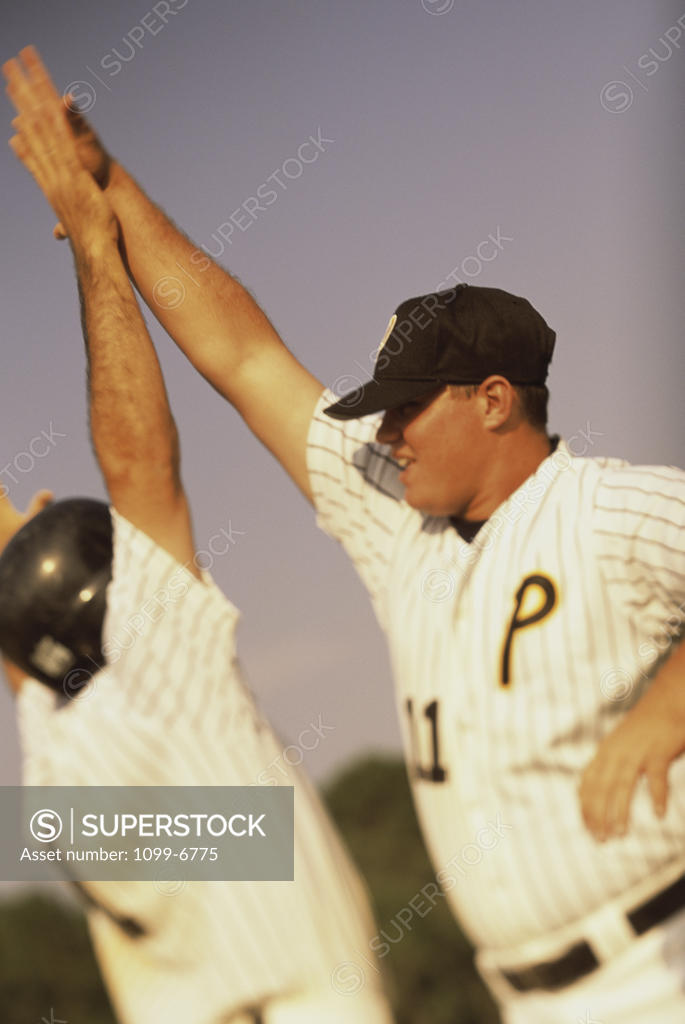 Stock Photo: 1099-6775 Two baseball players celebrating