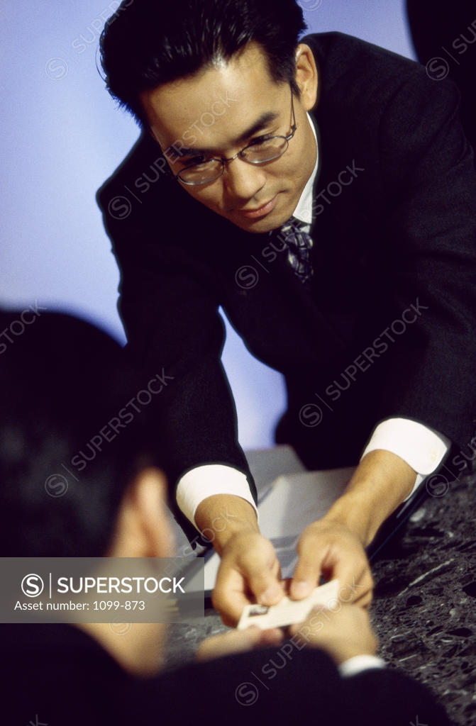 Stock Photo: 1099-873 Businessman giving his business card to a businessman