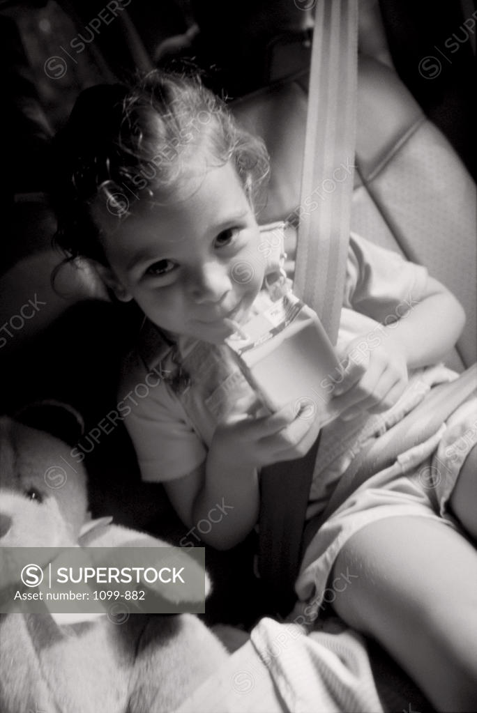 Stock Photo: 1099-882 Portrait of a girl drinking with a straw
