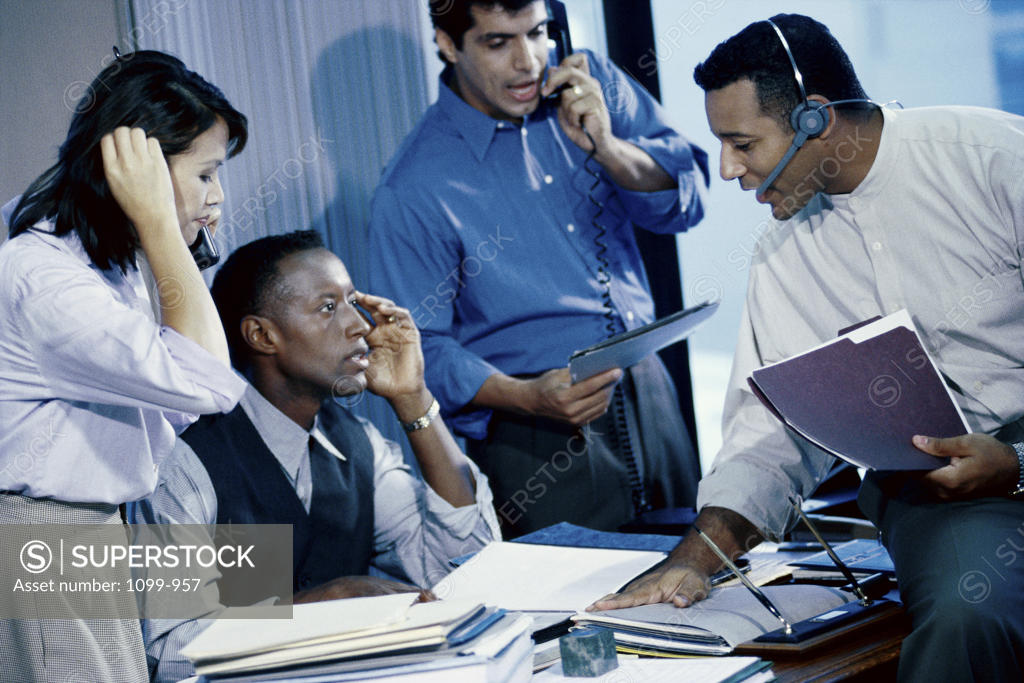 Stock Photo: 1099-957 Businesswoman with three businessmen in an office
