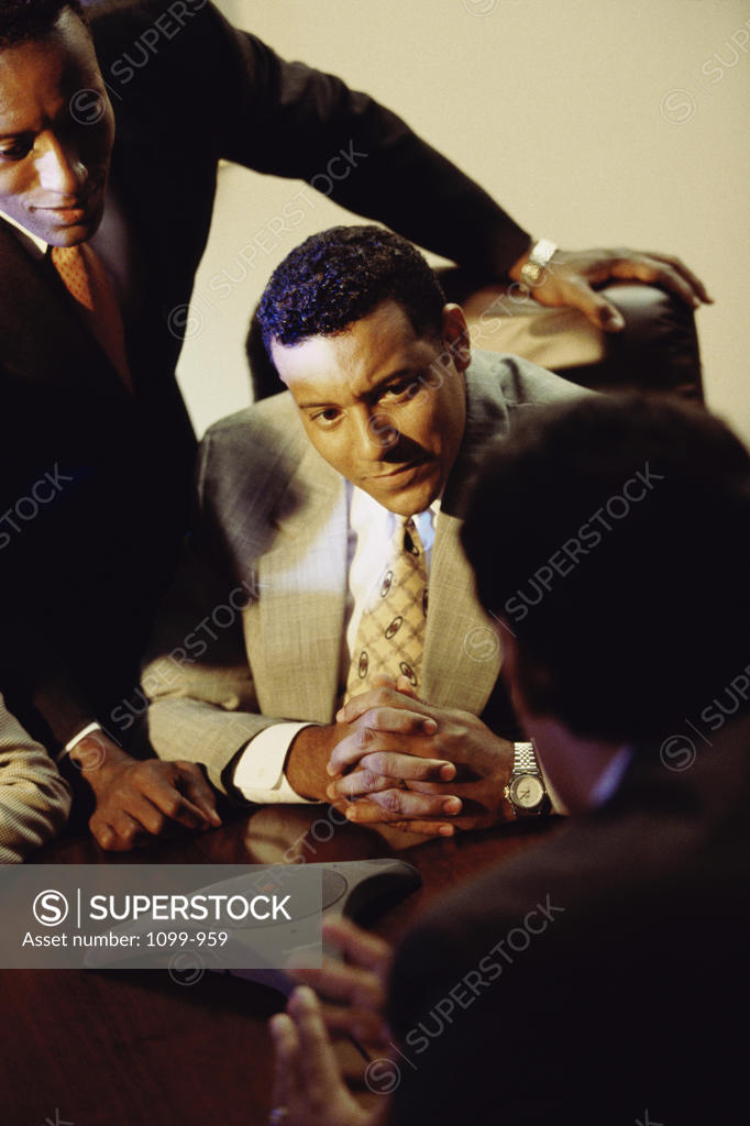 Stock Photo: 1099-959 High angle view of three businessmen in an office
