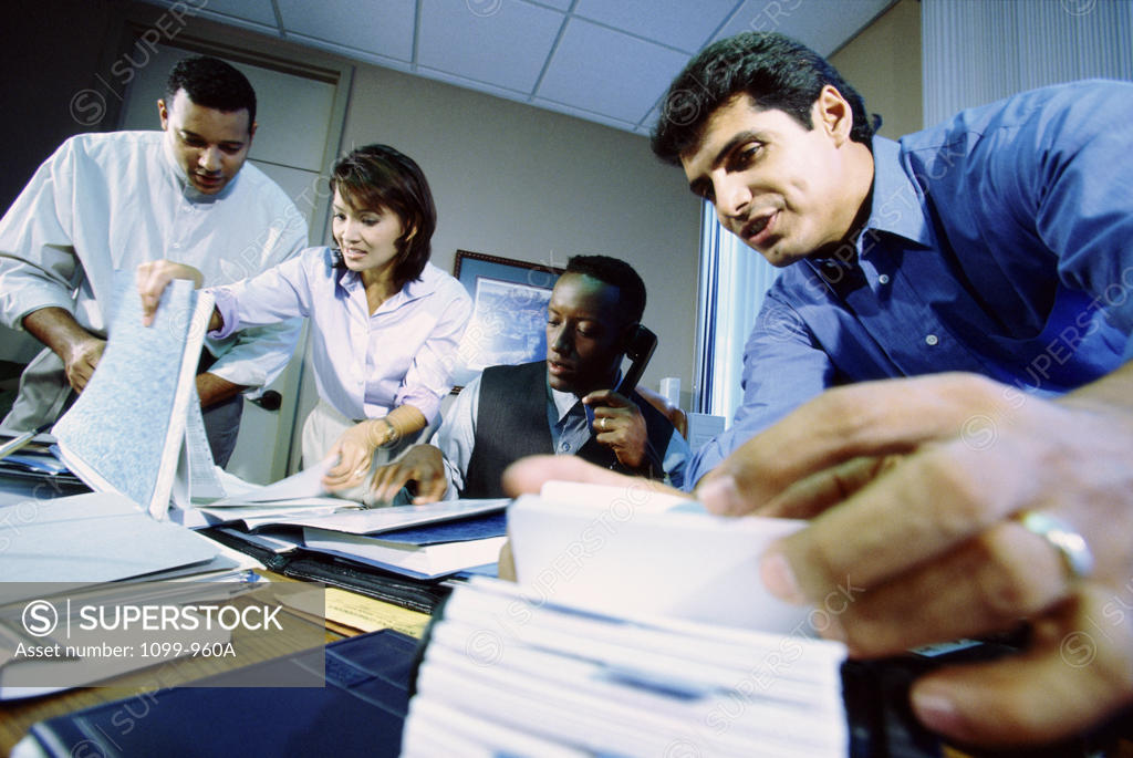Stock Photo: 1099-960A Businesswoman with three businessmen in an office