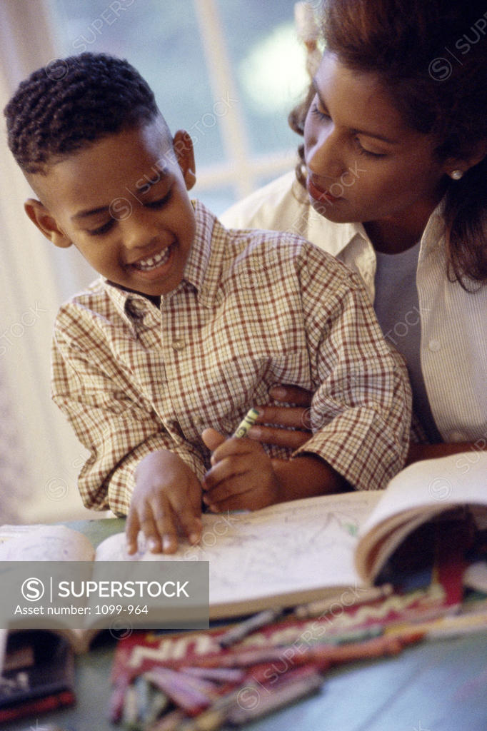 Stock Photo: 1099-964 Mother teaching her son