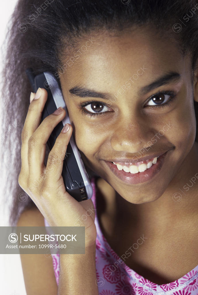 Stock Photo: 1099R-5680 Portrait of a teenage girl talking on a mobile phone