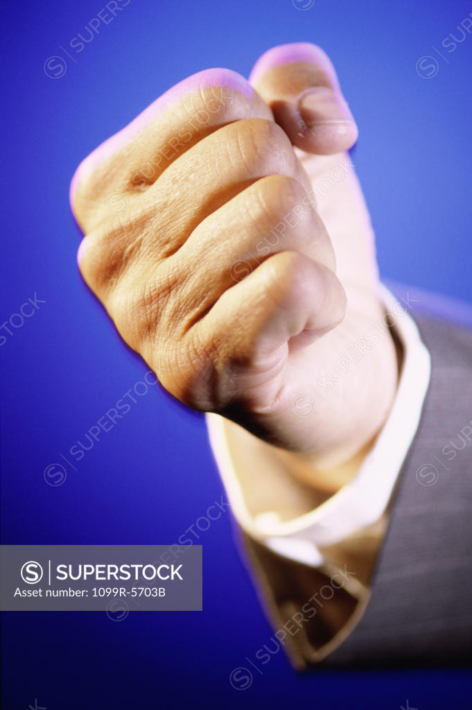Stock Photo: 1099R-5703B Close-up of a person's hand making a fist