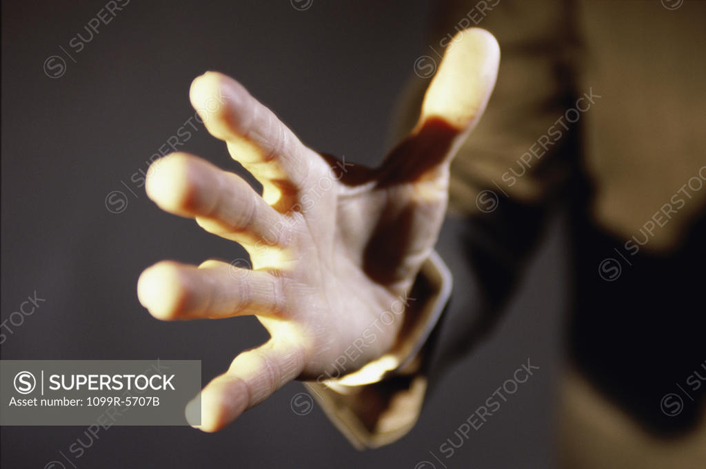 Stock Photo: 1099R-5707B Close-up of a person's hand reaching out