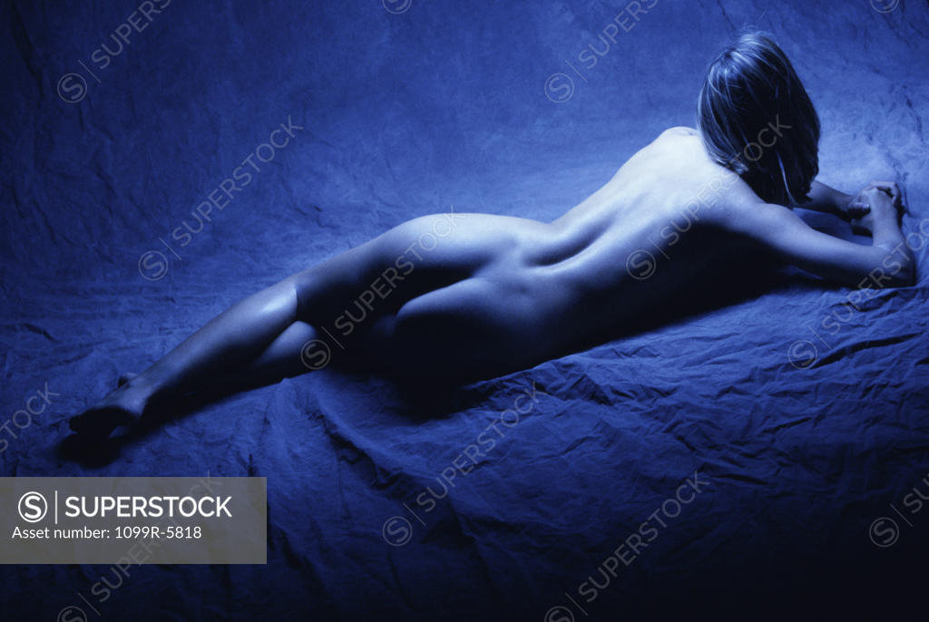Stock Photo: 1099R-5818 High angle view of a naked young woman lying down