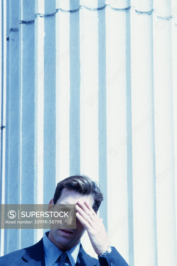 Stock Photo: 1099R-5879B Portrait of a worried businessman