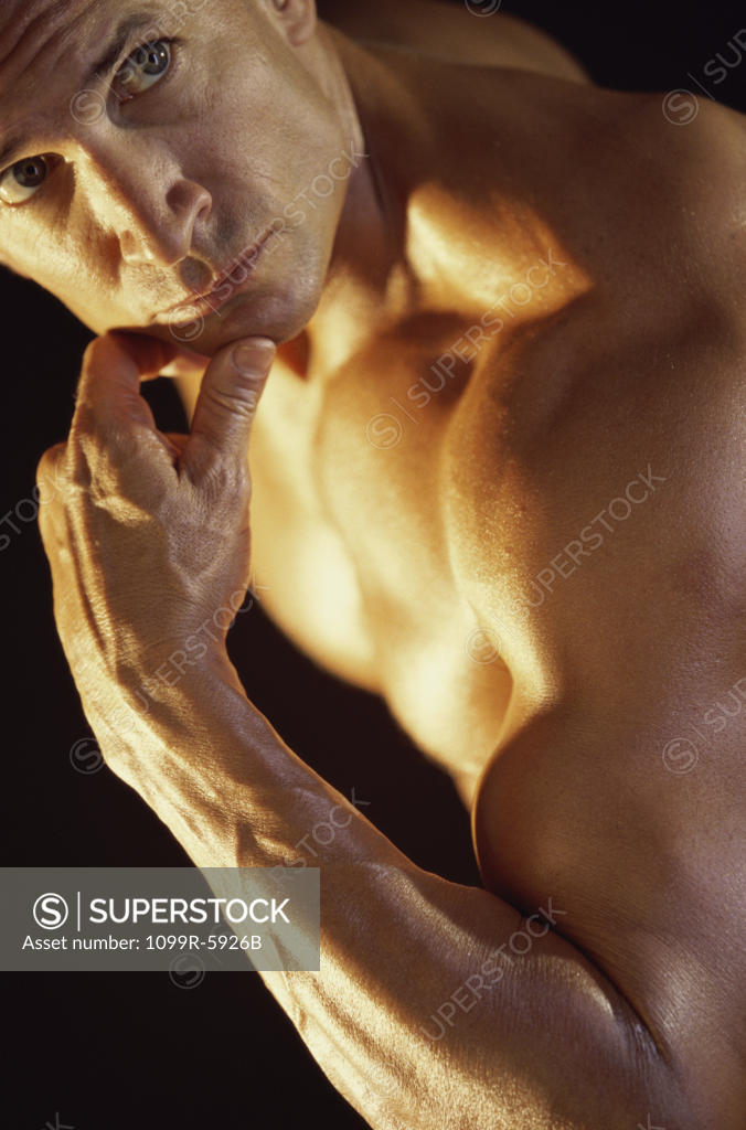 Stock Photo: 1099R-5926B Young man with his hand on his chin