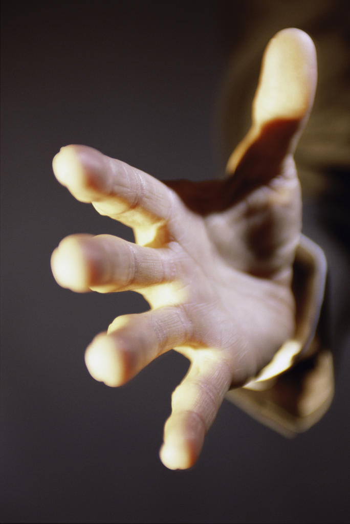 Close-up of a person's hand reaching out