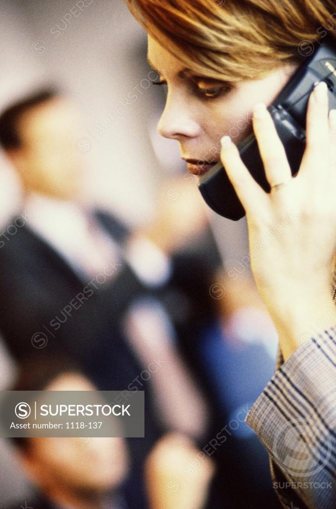 Stock Photo: 1118-137 Side profile of a businesswoman talking on a mobile phone